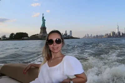 Yacht cruising past the Manhattan skyline